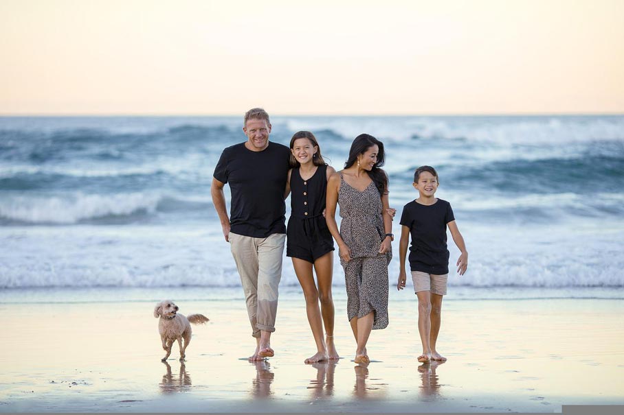 Family walking along the beach