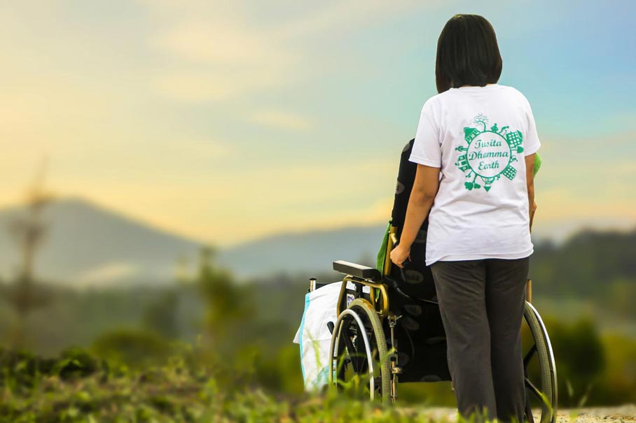 Mother in wheelchair with daughter looking at view