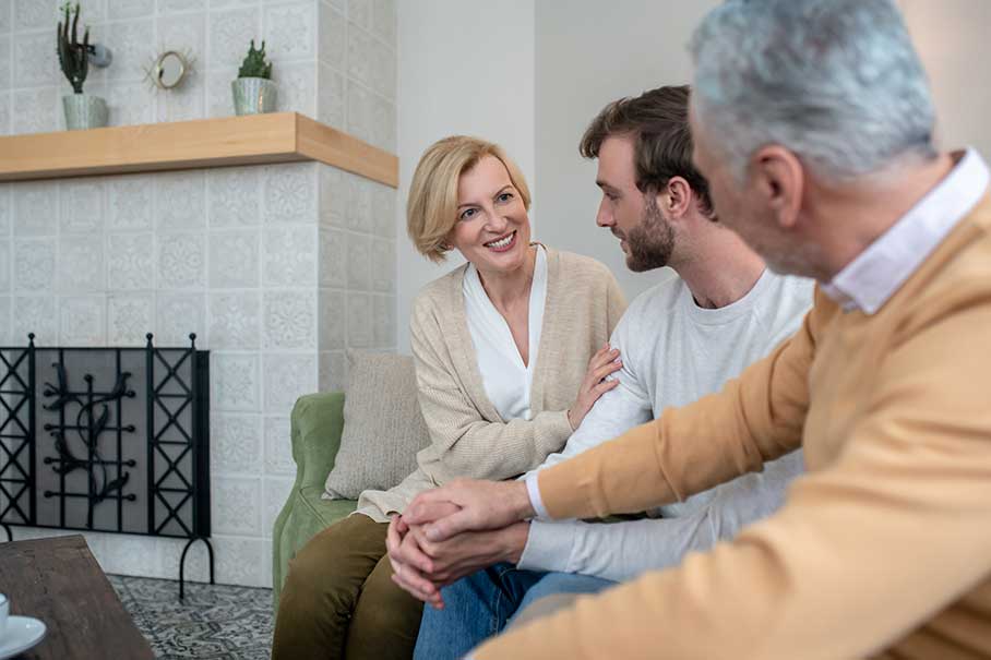 Family sitting together in the living room