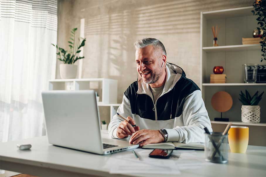 Man using a laptop computer at a desk